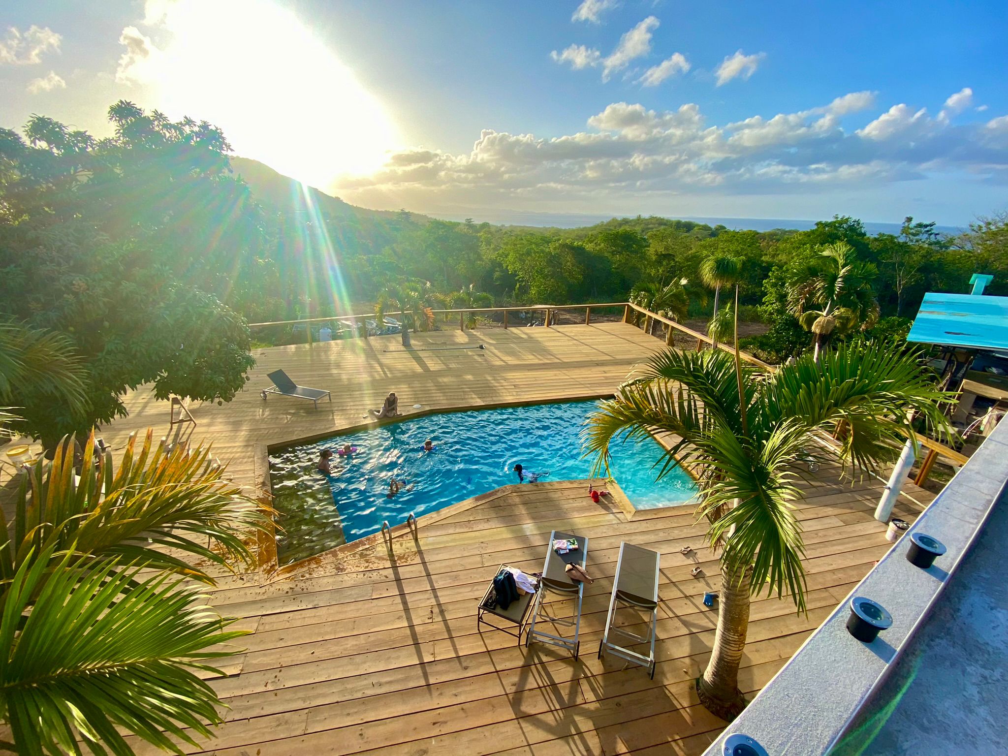 Elevated pool deck at Old Crow Hotel and Suites in Vieques Puerto Rico with Atlantic Ocean views at golden hour